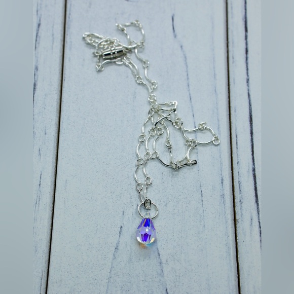 Crystal tear pendant on a delicate silver tone chain. - Picture 2 of 3